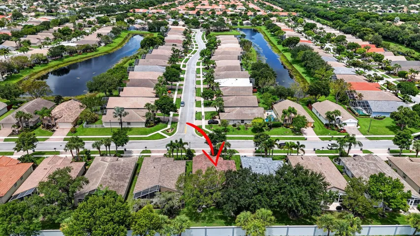 Aerial perspective showcasing a residential community with street access and surrounding waterways