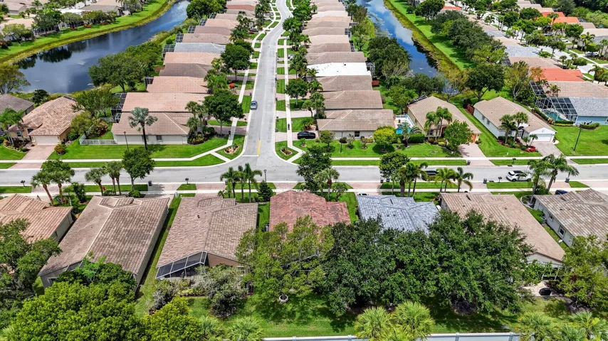 Aerial perspective showcasing a residential community with uniform home styles