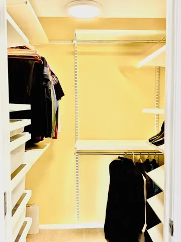 Primary bedroom walk-in closet