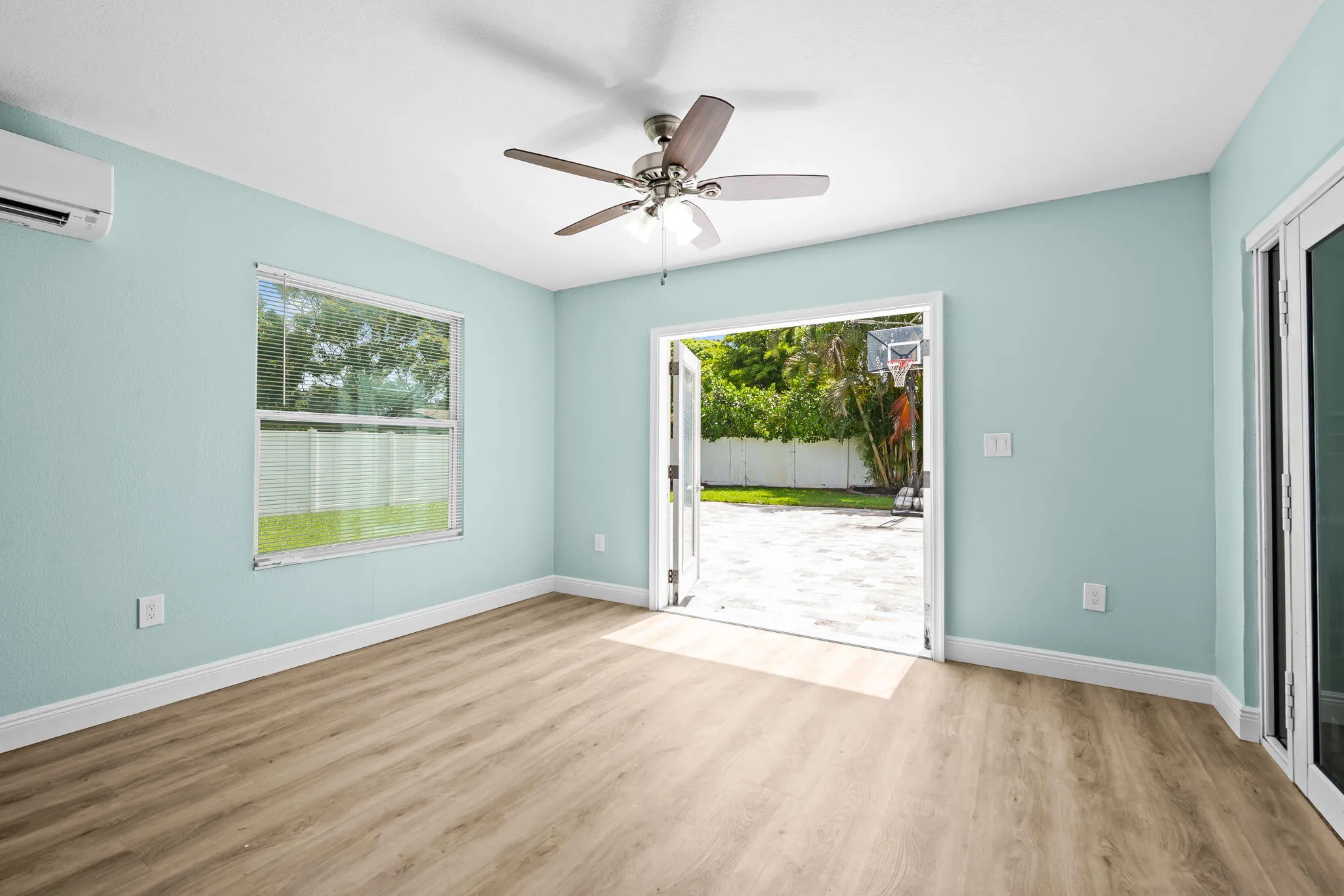 Enclosed Florida Room leading out to patio