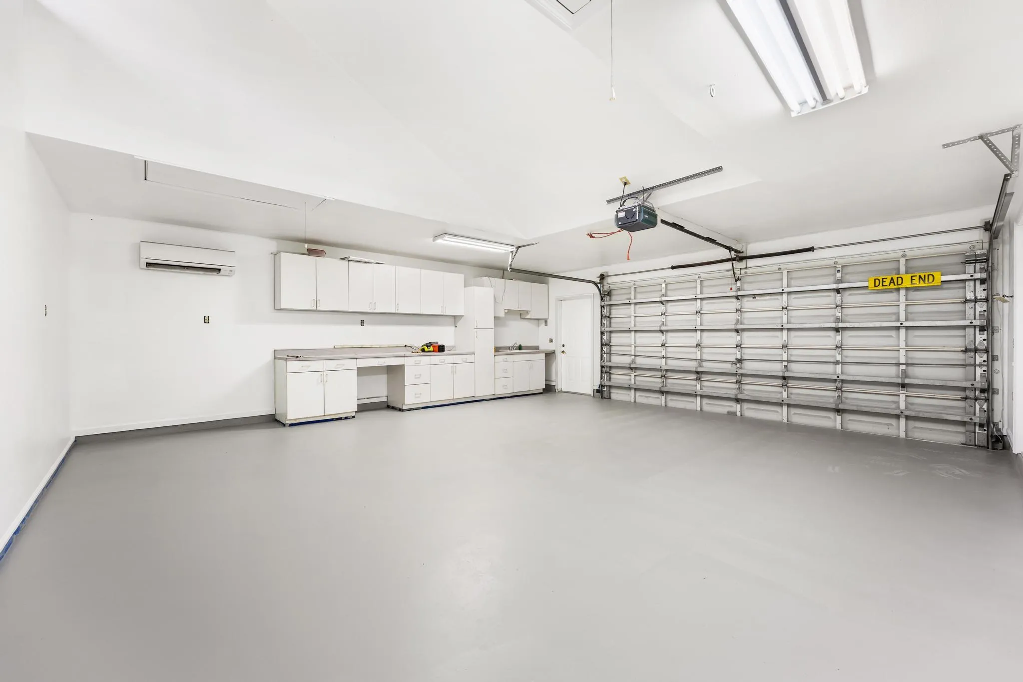 2nd 2-car garage with built-in shelving, plumbing and sink. Access to bathroom available