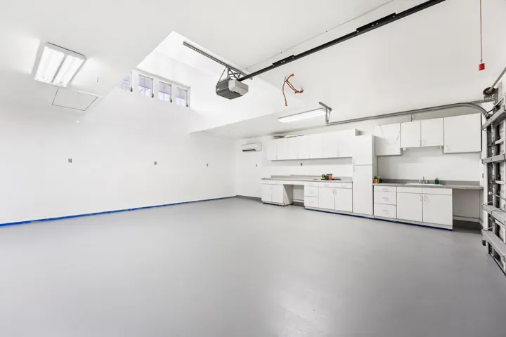 2nd 2-car garage with built-in shelving, plumbing and sink. Access to bathroom available