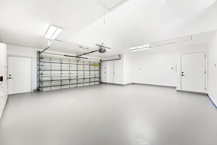 2nd 2-car garage with built-in shelving, plumbing and sink. Access to bathroom available