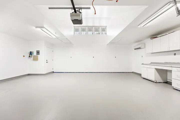 2nd 2-car garage with built-in shelving, plumbing and sink