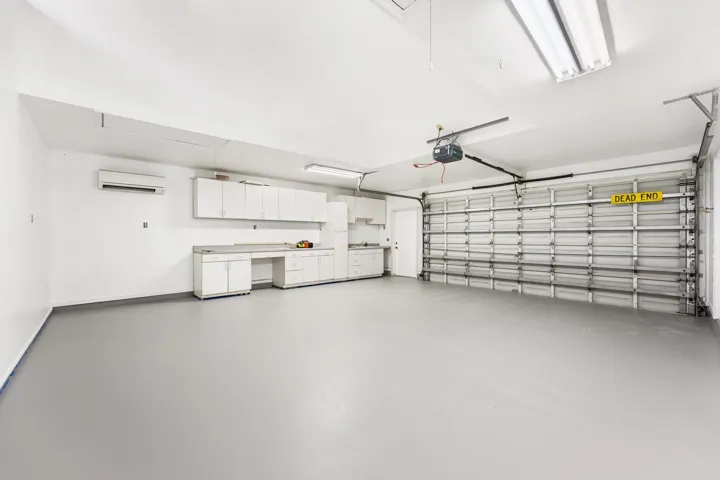 2nd 2-car garage with built-in shelving, plumbing and sink. Access to bathroom available