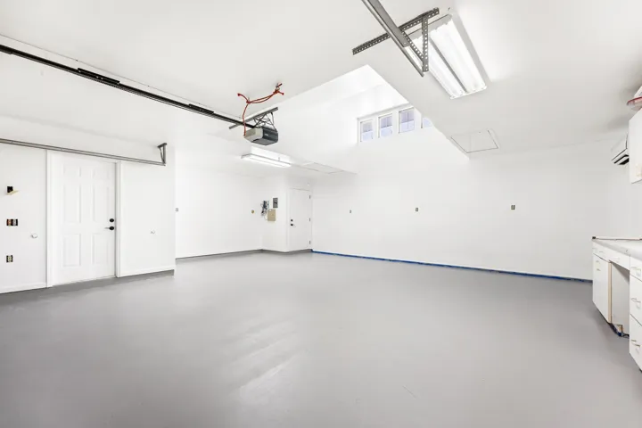 2nd 2-car garage with built-in shelving, plumbing and sink. Access to bathroom available