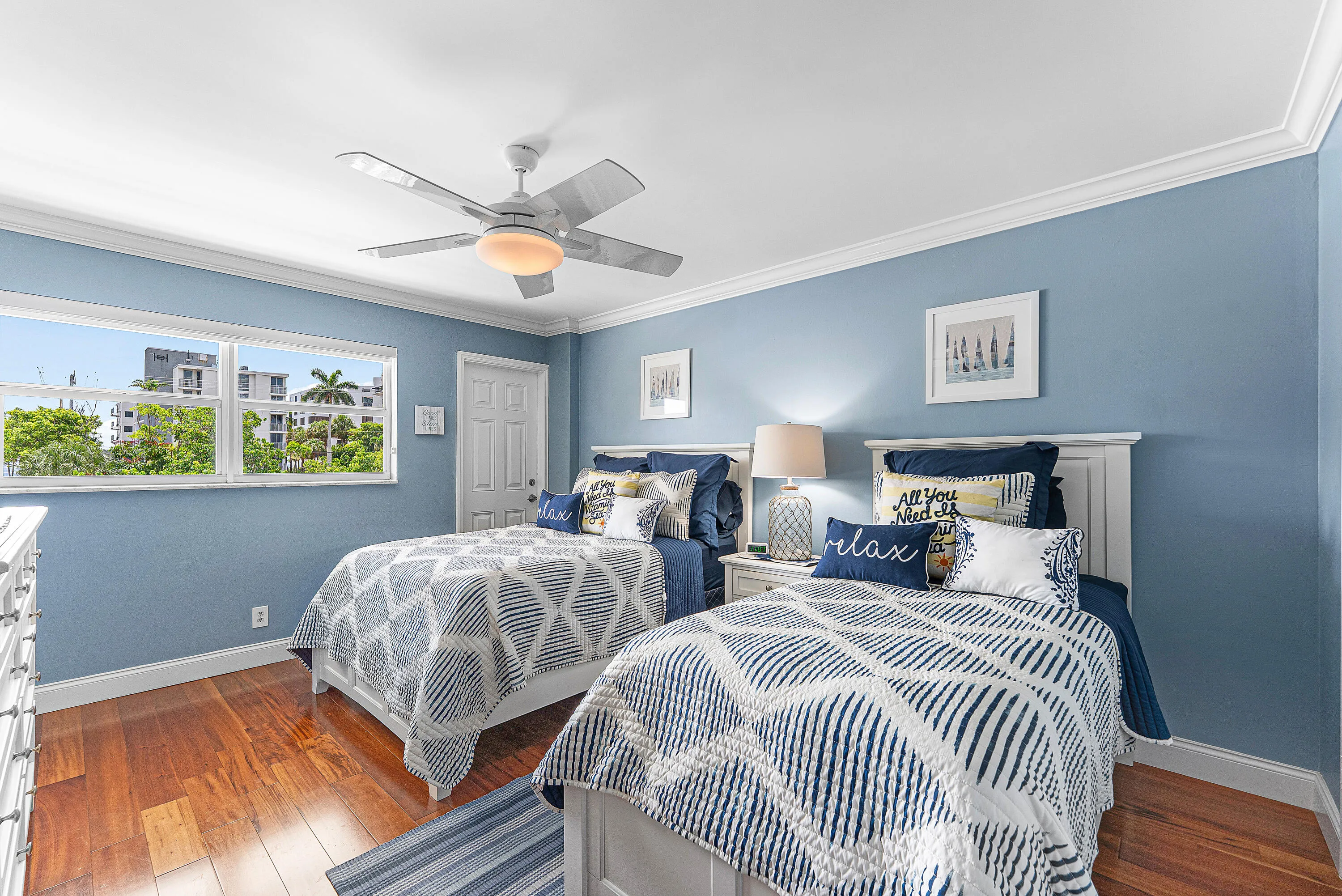 Second Bedroom featuring wood-finish flooring, a ceiling fan, and crown molding