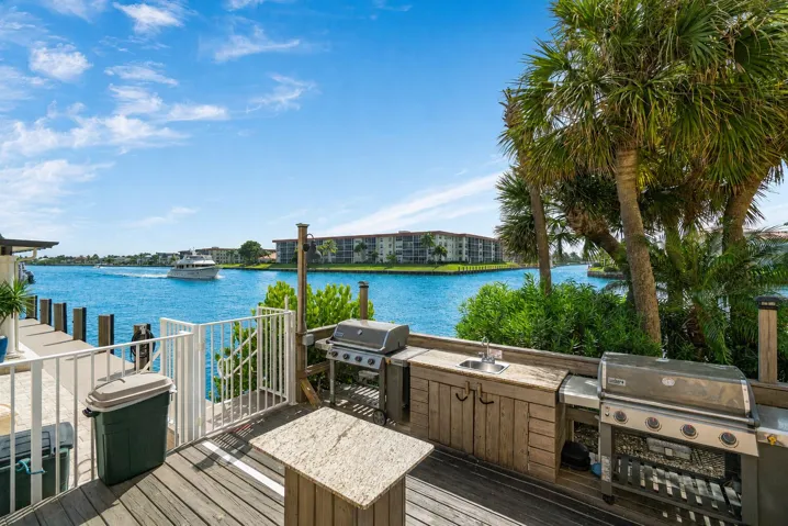 Beautiful waterfront grilling area with island and seating