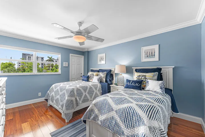 Second Bedroom featuring wood-finish flooring, a ceiling fan, and crown molding