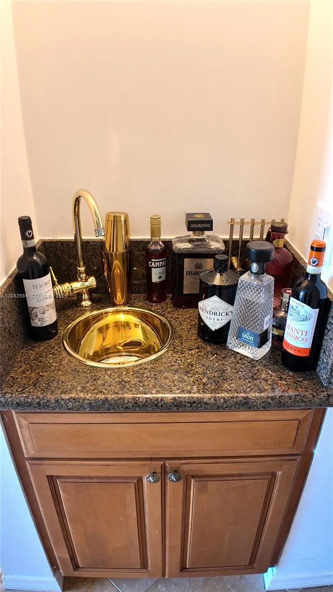 Wet bar located in hallway towards living room