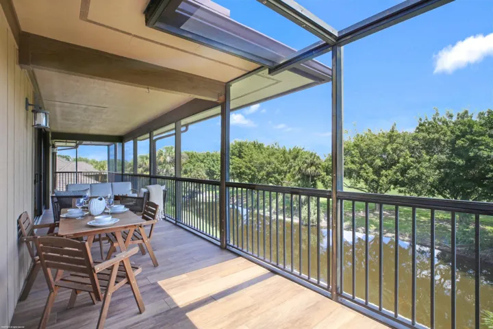 Screened balcony overlooking the water
