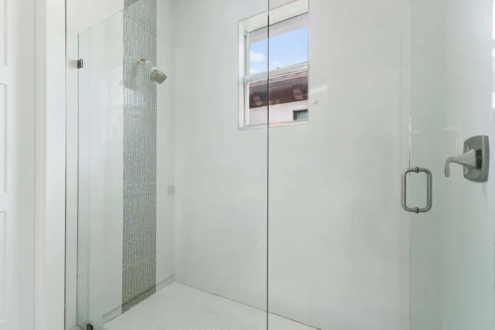 Glass-enclosed shower with window
