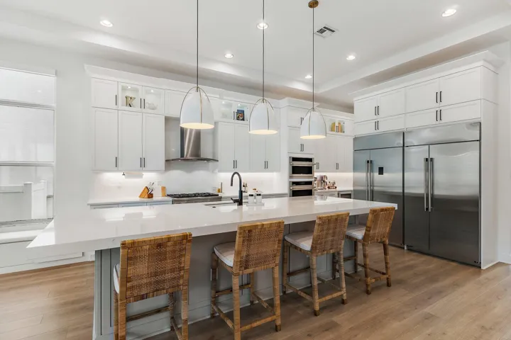 Kitchen with large center island, pendant lighting, and stainless steel appliances