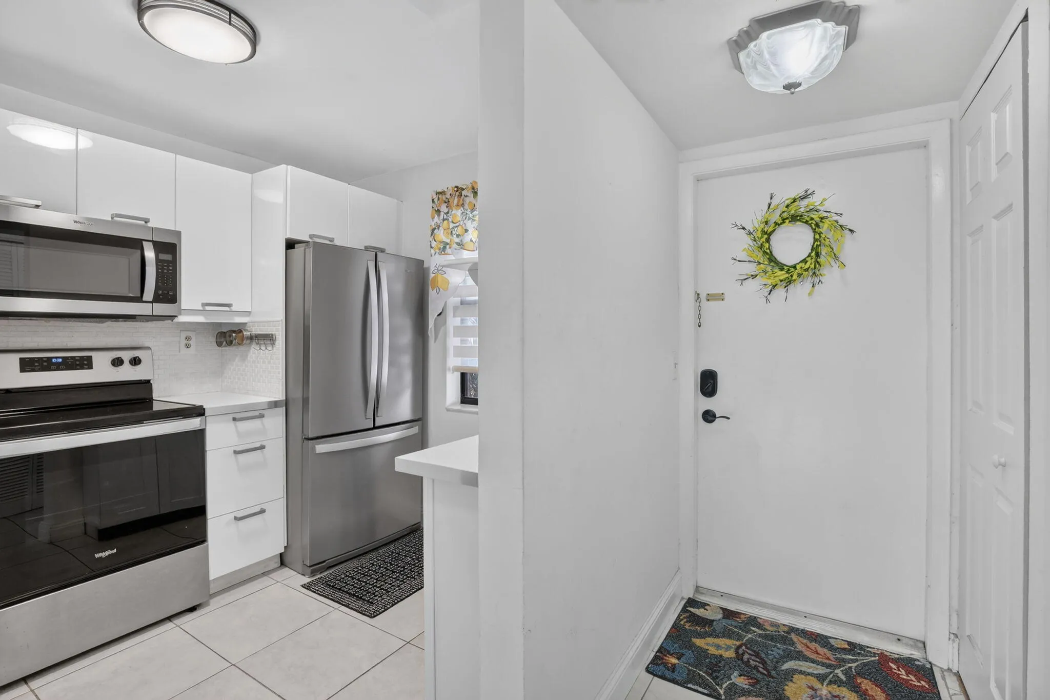 Entryway featuring overhead flush-mount lighting