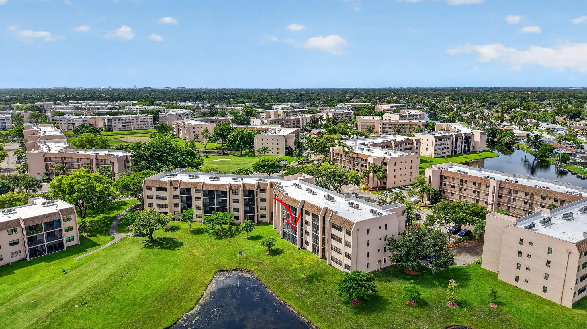 Aerial perspective showcasing a multi-story residential building with balconies
