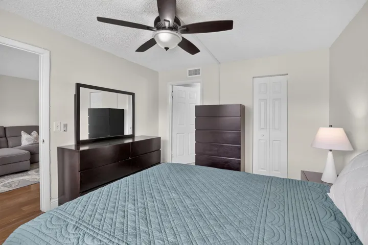 Neutral wall paint throughout, textured ceiling, ceiling fan with integrated lighting, bi-fold doors to the spacious walk-in closet