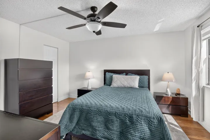 Primary Bedroom featuring laminate flooring and a ceiling fan with integrated lighting