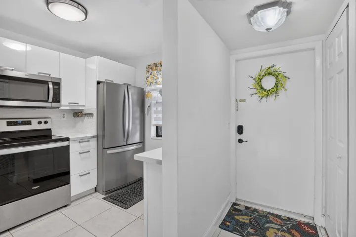 Entryway featuring overhead flush-mount lighting