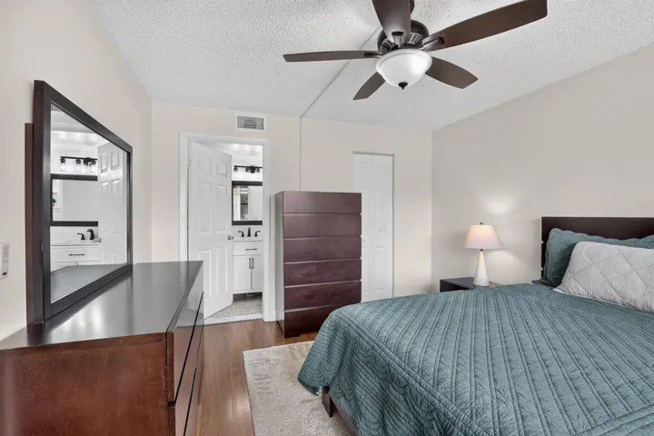 Primary Bedroom featuring laminate flooring, a ceiling fan with integrated lighting, and a neutral wall color