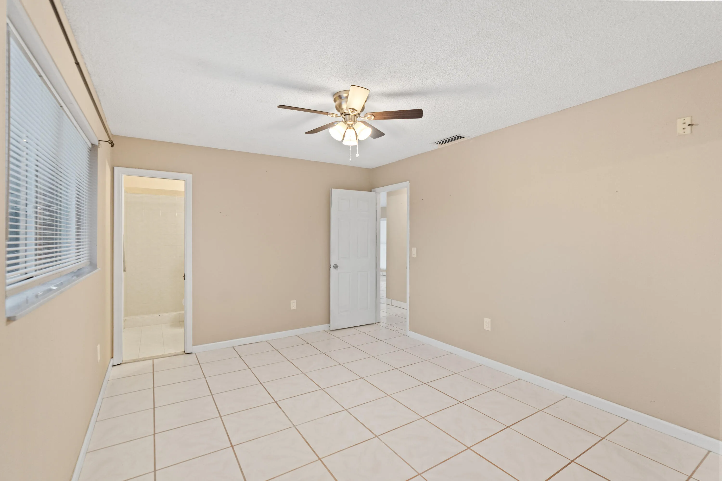 The primary suite includes a cabana bath with direct access to the pool.