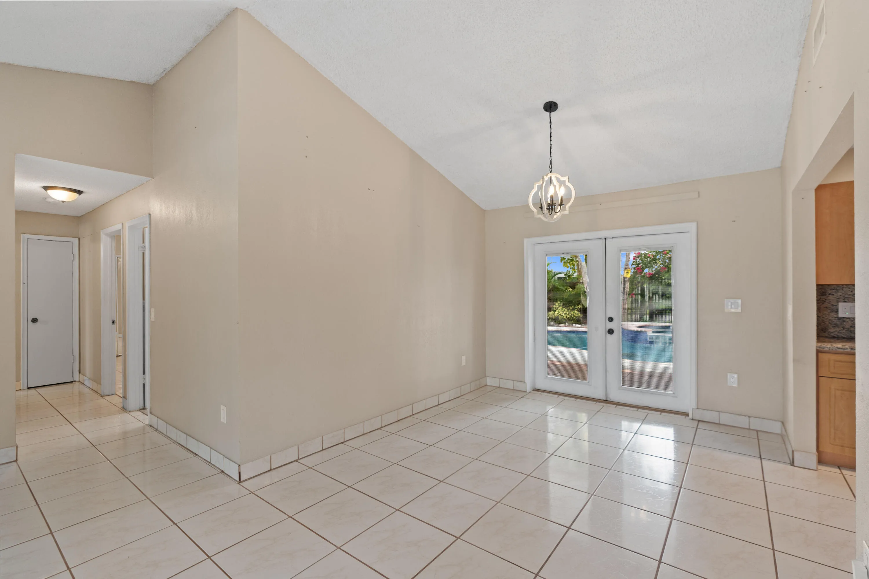 Inside, volume ceilings and an open great room create a bright, airy living space.