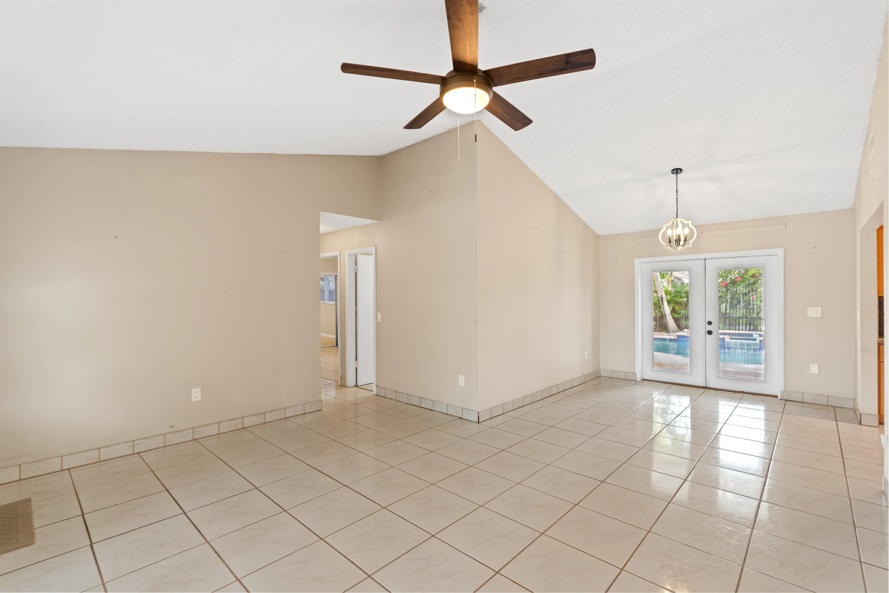 Inside, volume ceilings and an open great room create a bright, airy living space.