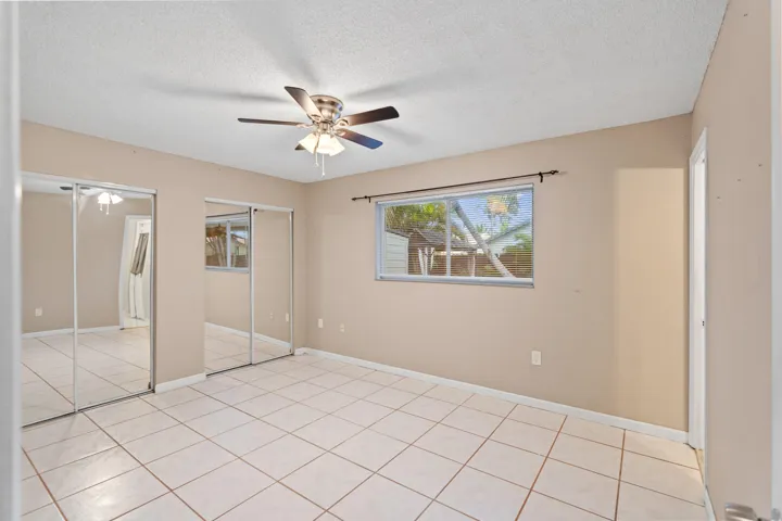 The primary suite overlooks the backyard and has a cabana bath with direct access to the pool.