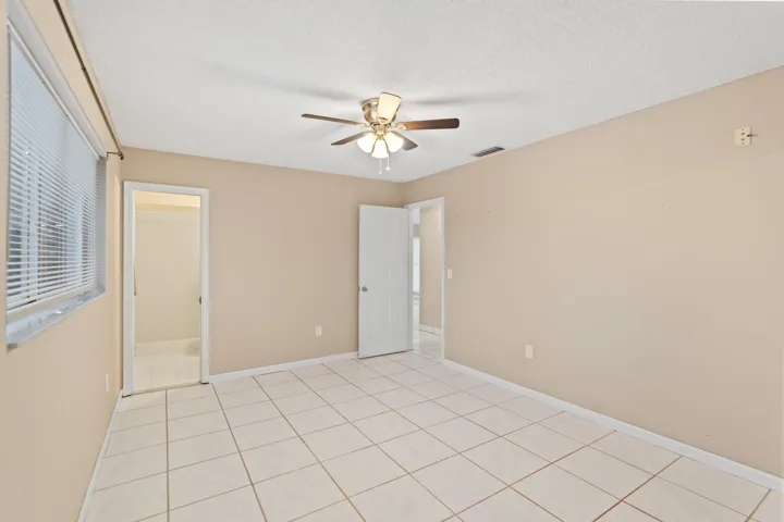 The primary suite includes a cabana bath with direct access to the pool.