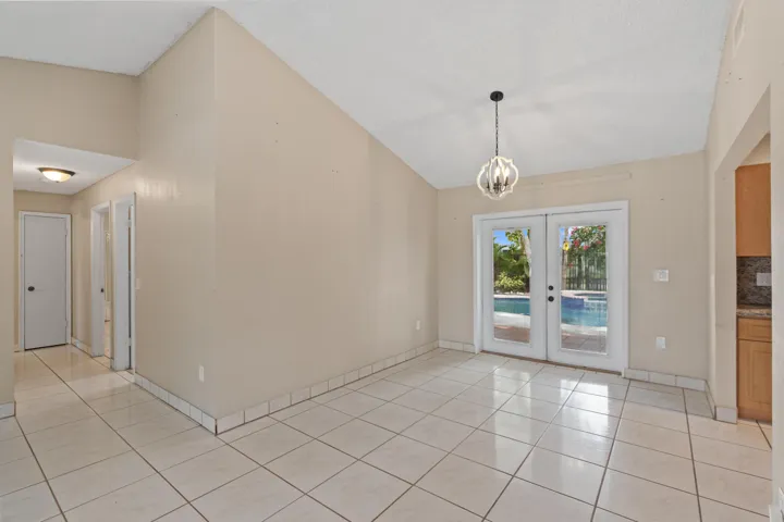 Inside, volume ceilings and an open great room create a bright, airy living space.
