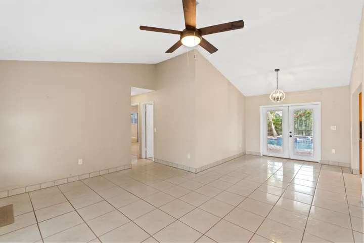 Inside, volume ceilings and an open great room create a bright, airy living space.