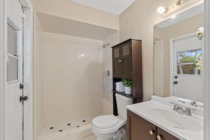 The primary suite includes a cabana bath with direct access to the pool.