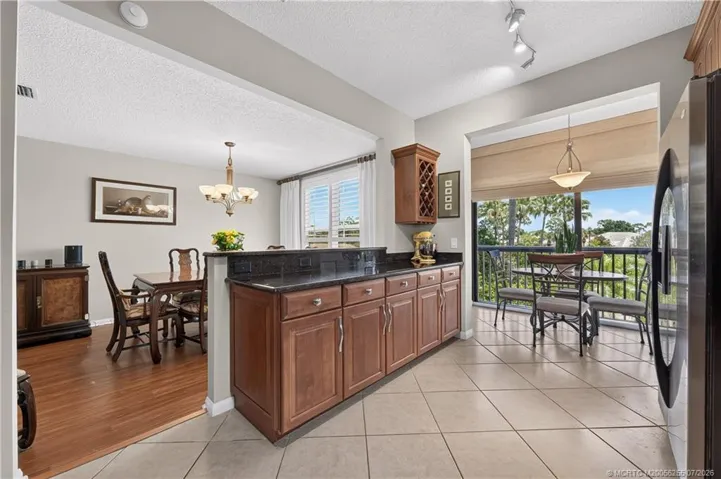 Renovated Kitchen with Work Area and Dining Room Pass-Thru