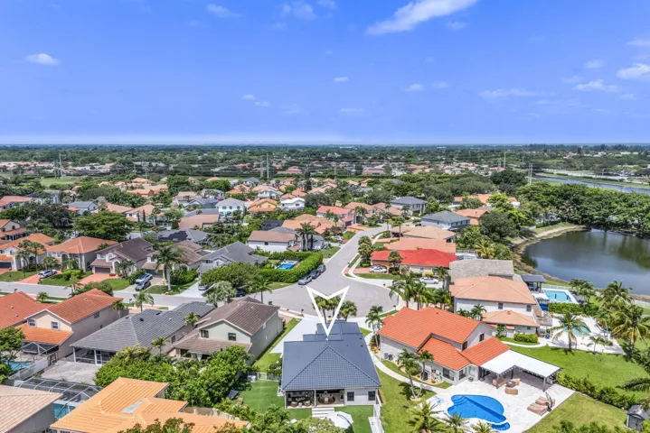 Aerial perspective showcasing a residential area with a prominent corner lot