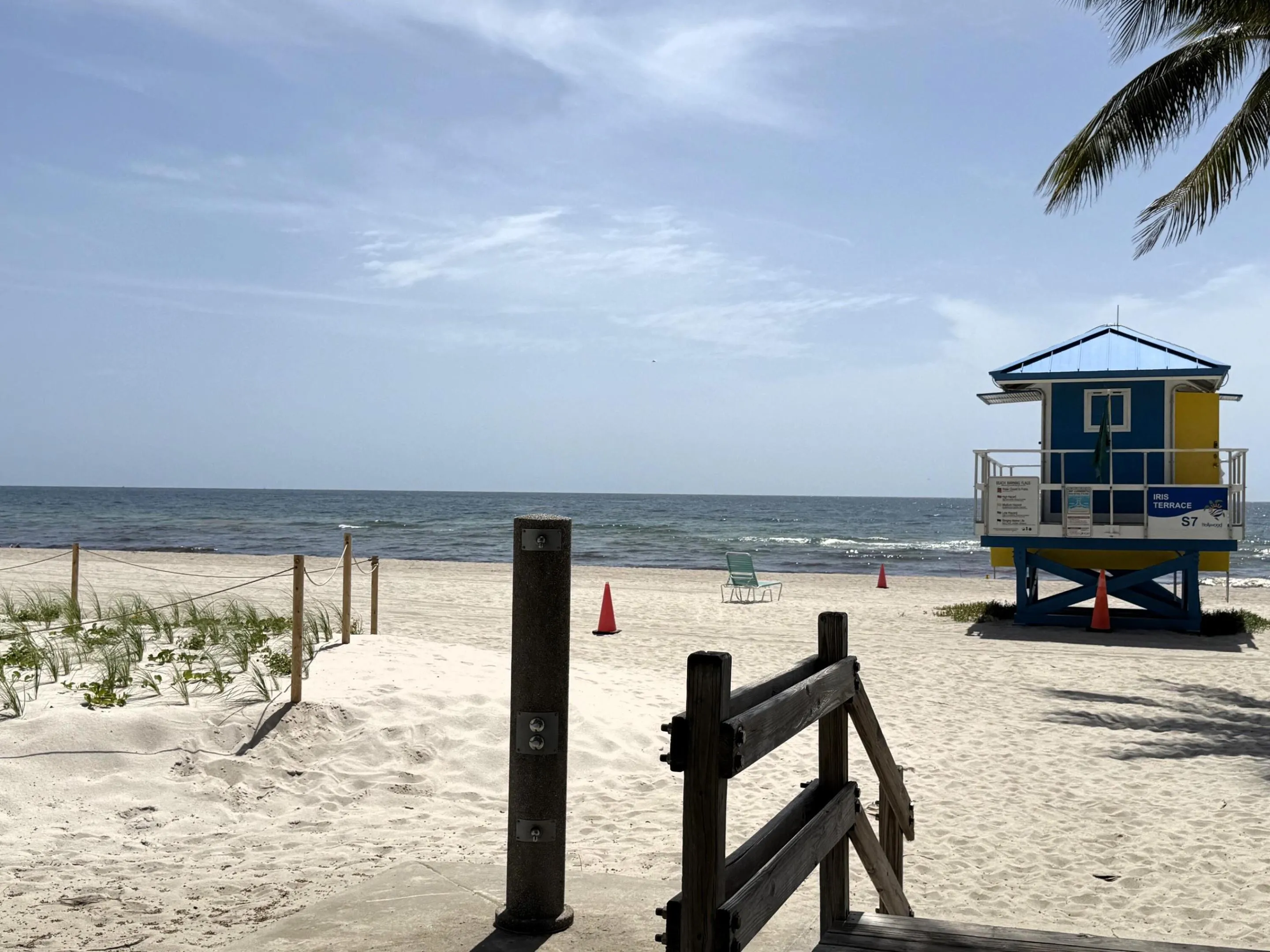 Expansive beach with white sand and ocean waters