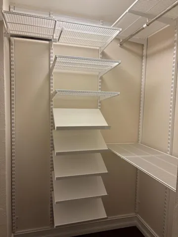 Elfa custom closet system, offering highly adjustable modular shelving and storage designed to maximize organization and functionality.
