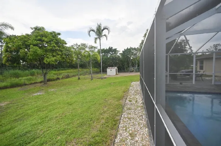 Rock barrier around pool to save screen