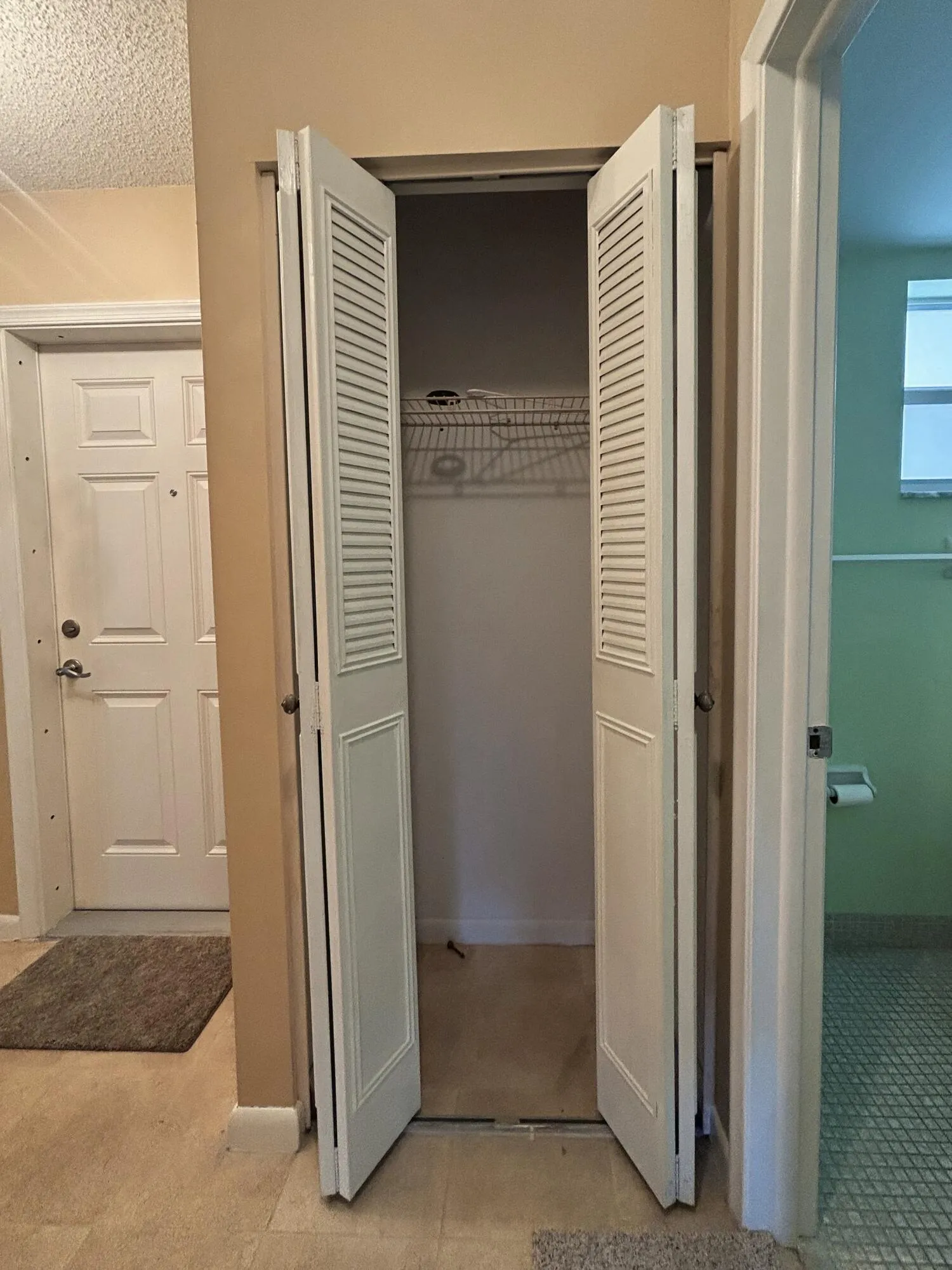 HALL CLOSET BY FRONT DOOR