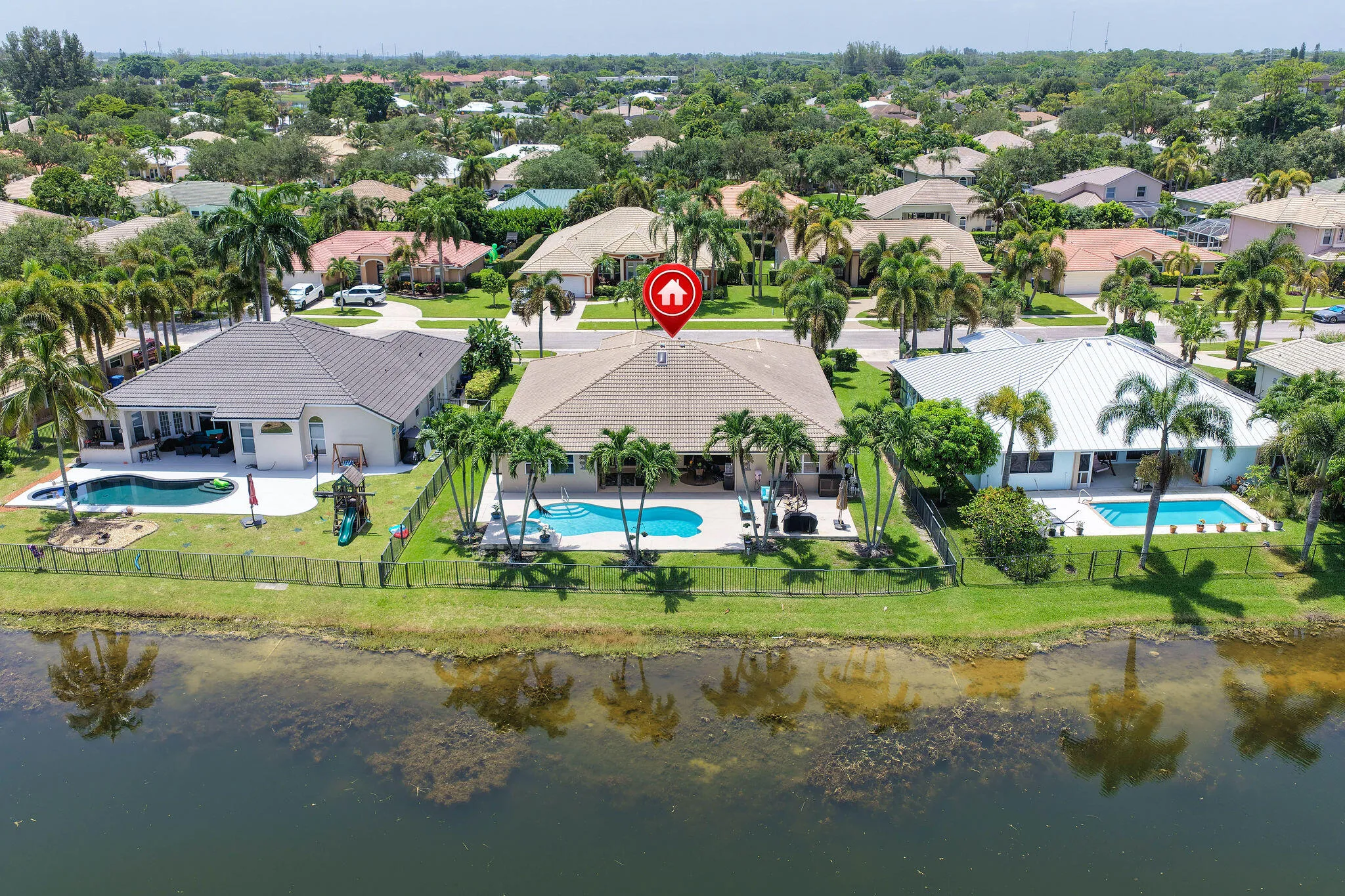 Lakefront home with private, fenced yard, heated pool and spa