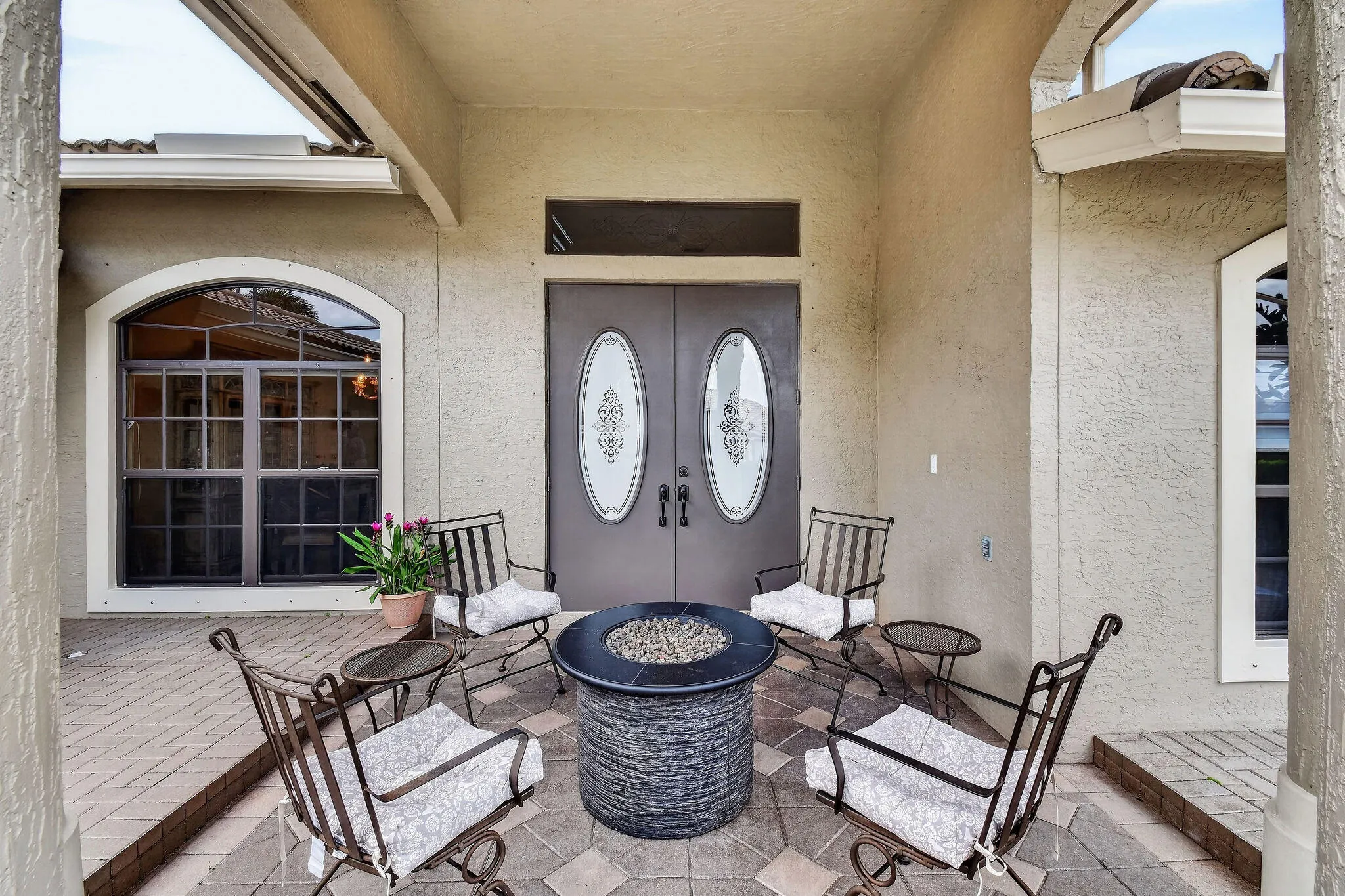 Covered entry. Double front doors.