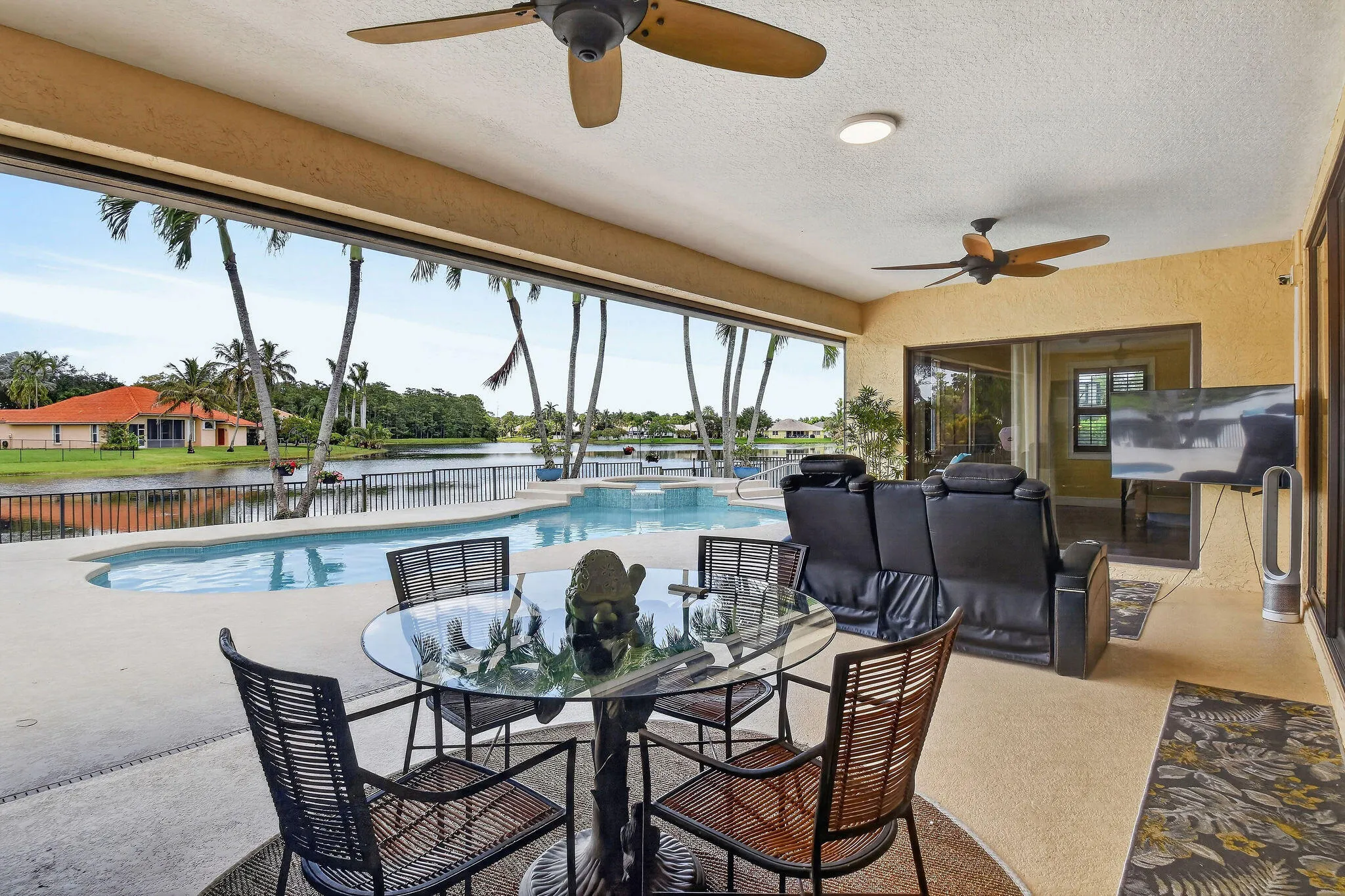 12 by 25 covered porch. Motorized screens. Ceiling fans.