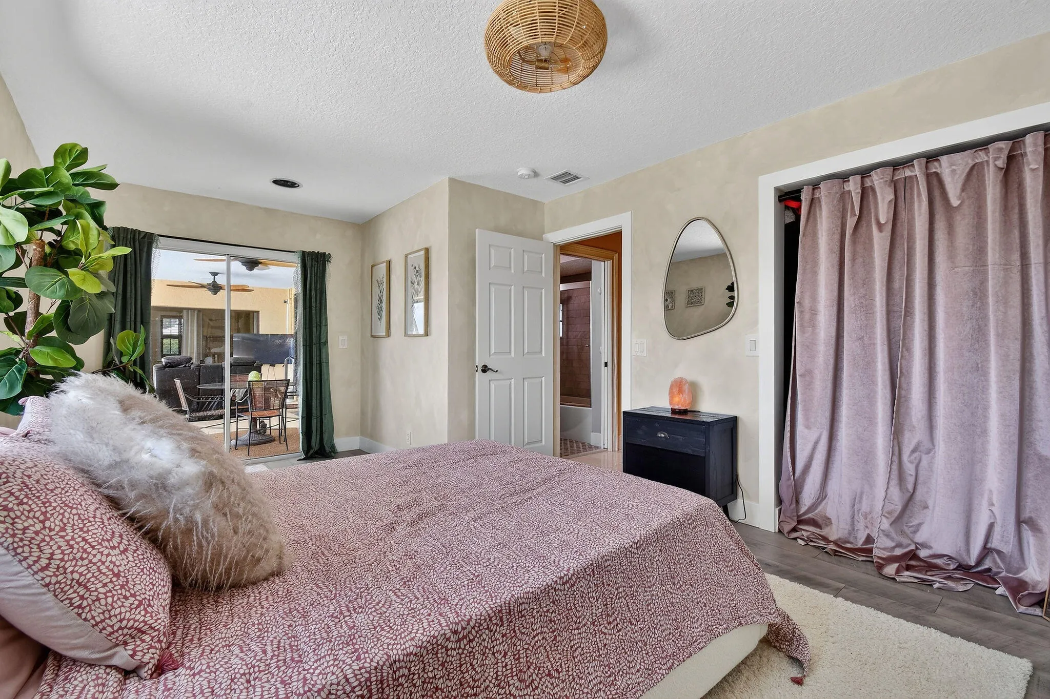 Bedroom 4 with sliders to the porch and pool.