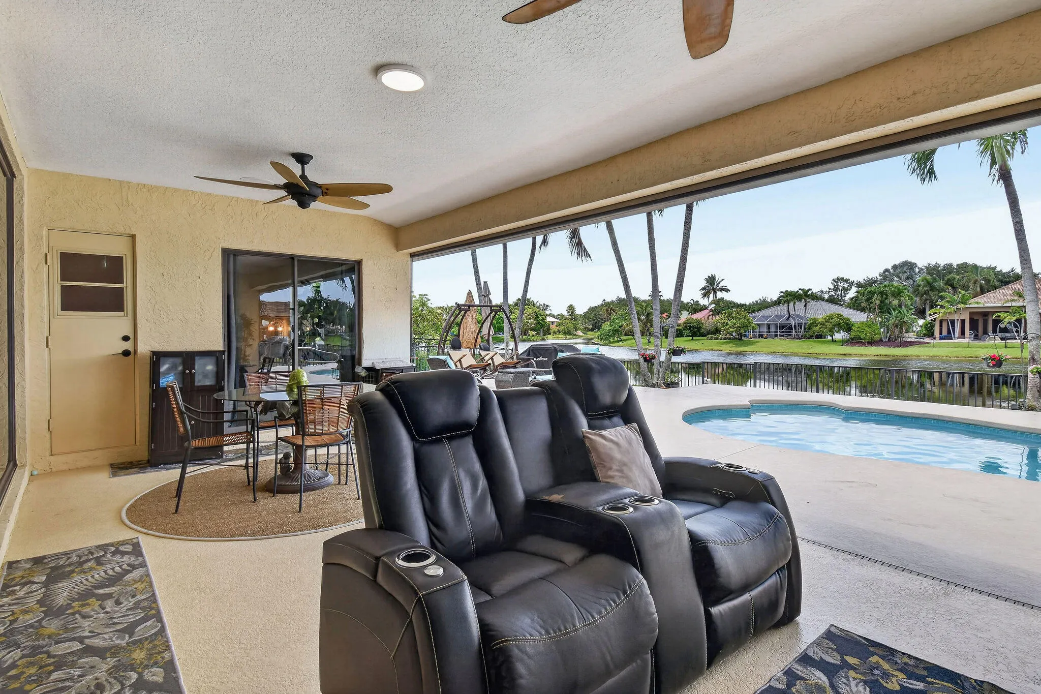 12 by 25 covered porch. Motorized screens. Ceiling fans.