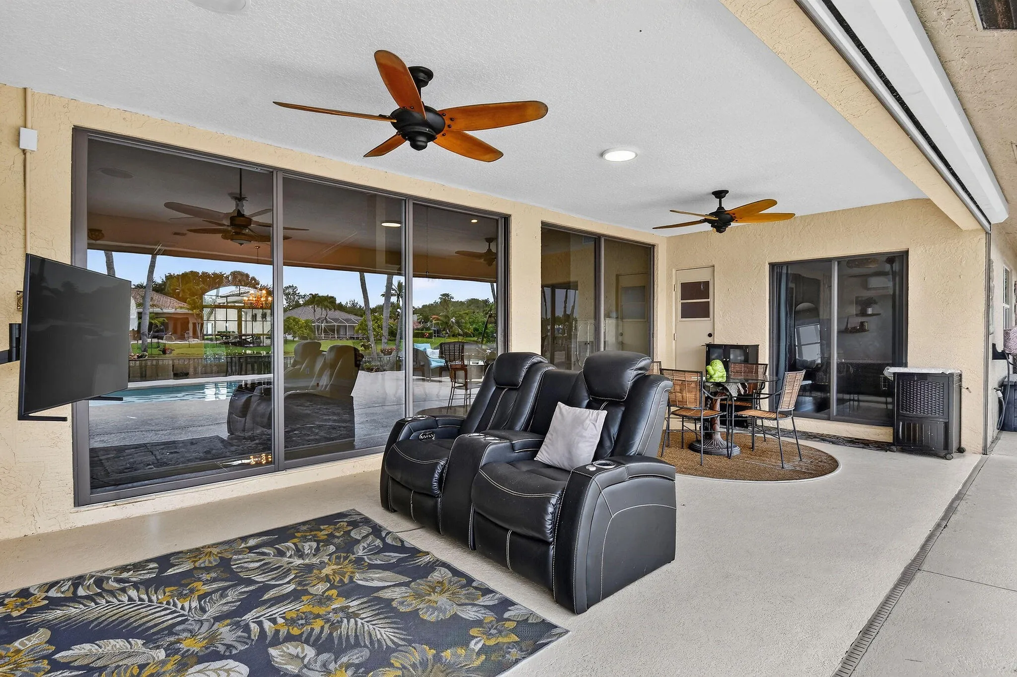 12 by 25 covered porch. Motorized screens. Ceiling fans.
