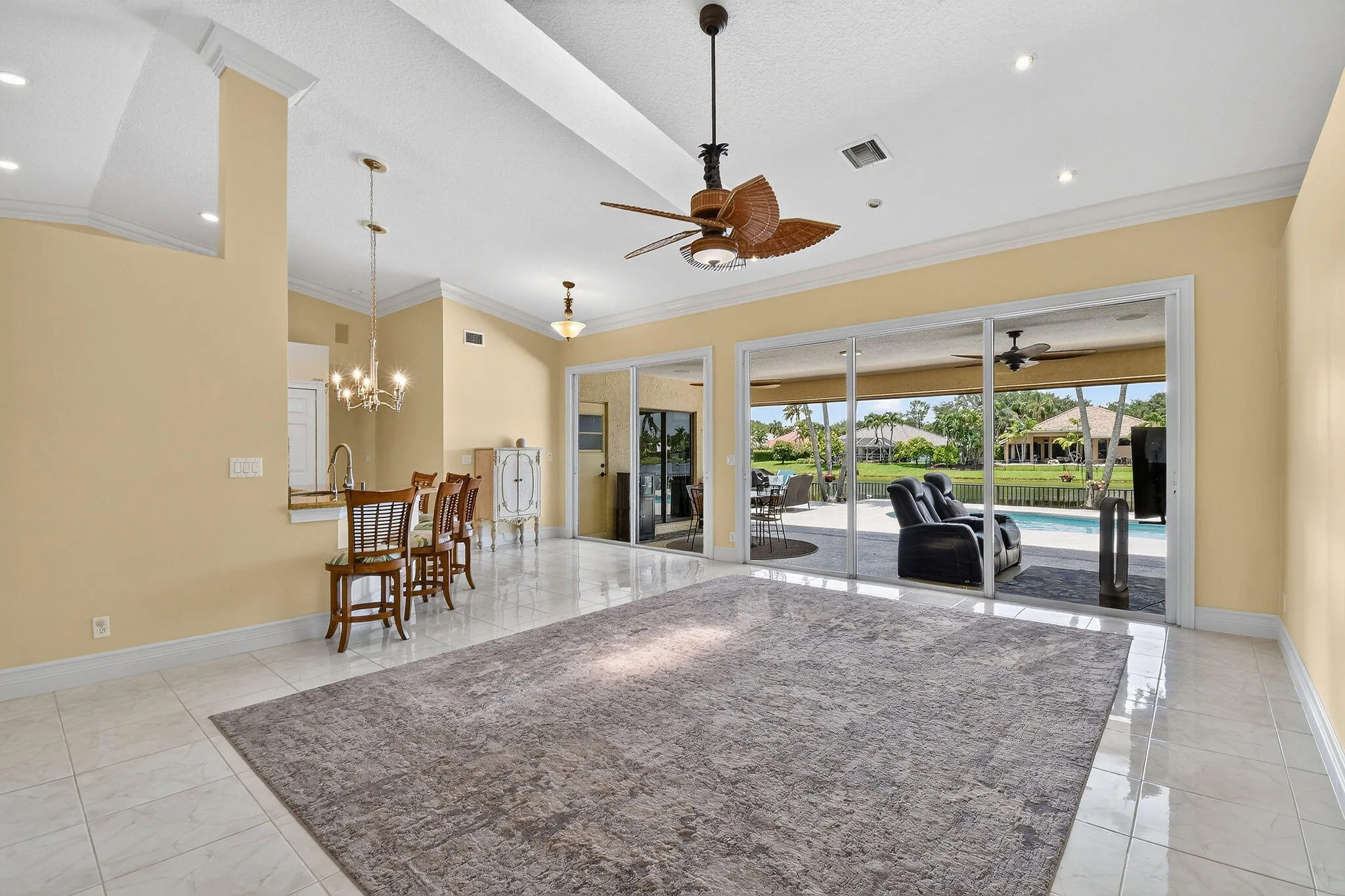 Living room with breakfast bar and open kitchen to the left.