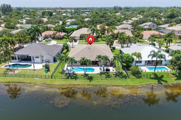 Lakefront home with private, fenced yard, heated pool and spa