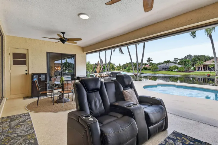 12 by 25 covered porch. Motorized screens. Ceiling fans.