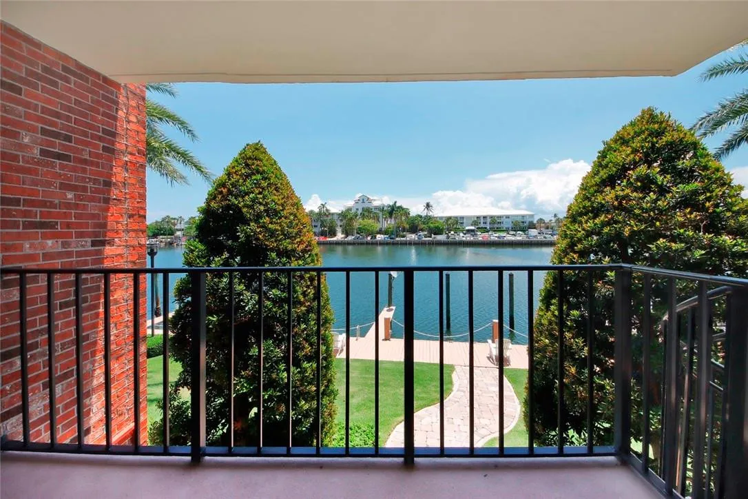 Balcony with spiral stairs with direct access to the the docks and the pool.