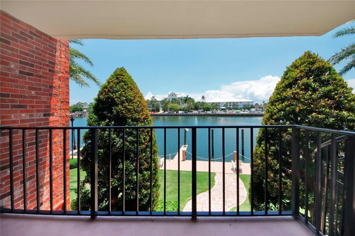 Balcony with spiral stairs with direct access to the the docks and the pool.