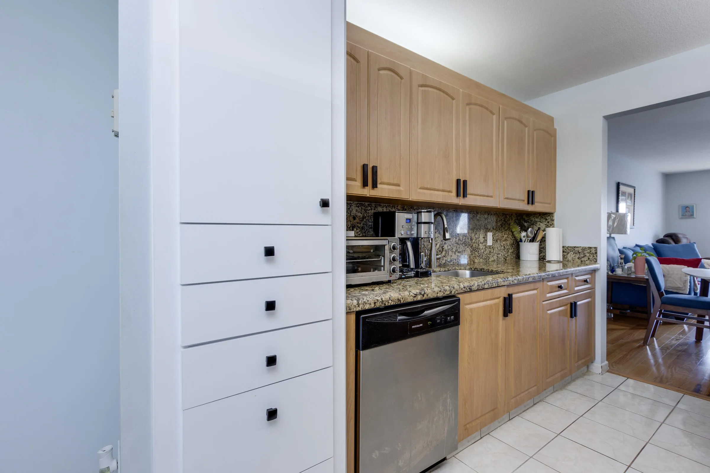 Updated kitchen with built-in pantry, pull out drawers & storage.