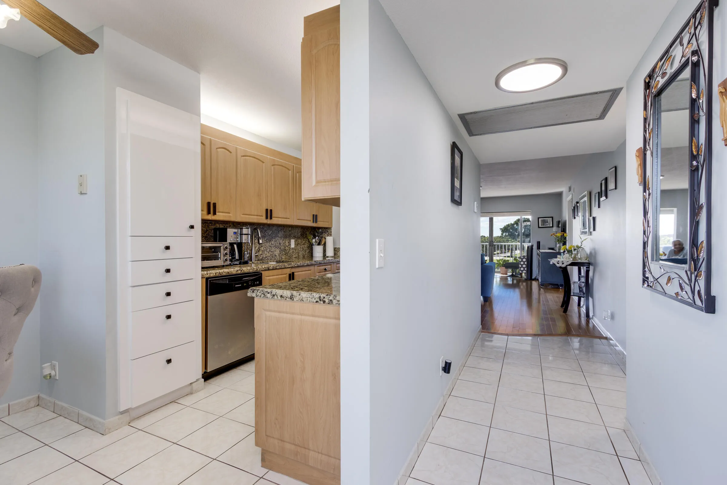 Breakfast area & kitchen to the left. Access to great room, balcony & bedrooms to the right